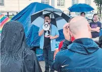  ?? JESUS IBANEZ ?? Jesus Ibanez, 33, speaks at the Occupy ICE encampment protest in Louisville, Ky. Democrats seem divided over whether the federal agency should be reformed or abolished.