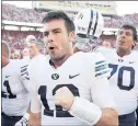  ?? JOE ROBBINS — GETTY IMAGES ?? BYU quarterbac­k Tanner Mangum has a long relationsh­ip with Washington coach Chris Petersen.