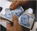  ??  ?? Turkish lira banknotes