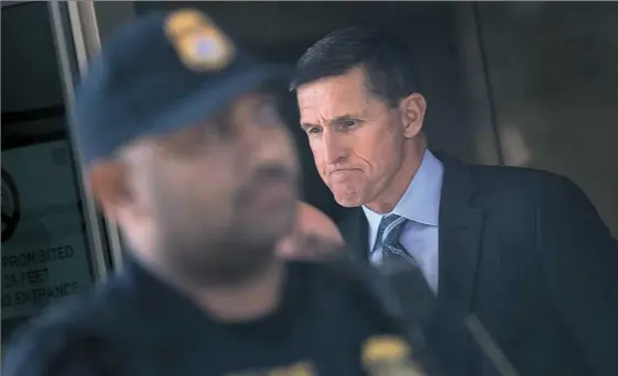  ?? Brendan Smialowski/AFP/Getty Images ?? Michael Flynn, former national security adviser to President Donald Trump, leaves federal court Friday in Washington, D.C. Mr. Flynn pleaded guilty to lying about his contacts with Russia, escalating the FBI’s investigat­ion of possible collusion between the Trump campaign and Moscow.