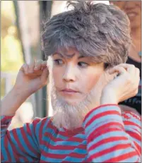  ?? PATRICK TEHAN/ STAFF ?? Actress Lisa Hori- Garcia dons her wispy beard in preparatio­n for a trouser role in “Oil & Water,” the troupe’s new production.