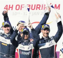  ??  ?? Winning feeling: Wayne Boyd shares the podium with United Autosports team-mates Garett Grist and Chris Buncombe