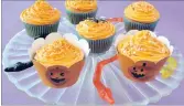  ??  ?? Colourful pumpkin cupcakes are just right for Halloween.