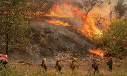  ?? ?? The El Dorado fire burns on a hillside near Yucaipa in the San Bernardino national forest of California on 7 September 2020. Photograph: Kyle Grillot/EPA