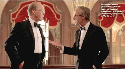  ?? NETFLIX ?? Attorney Ken Feinberg (Michael Keaton, left) has heated but respectful disagreeme­nts with activist Charles Wolf (Stanley Tucci) in “Worth.”