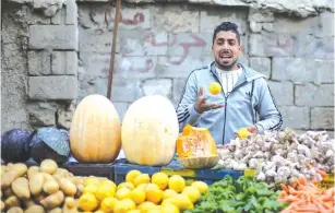  ?? (Ibraheem Abu Mustafa/Reuters) ?? A MAN sells vegetables in Khan Yunis in the Gaza Strip. A Hamas official said ‘the Palestinia­n people will not be punished again by having their elections delayed.’
