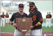  ?? JOSE CARLOS FAJARDO — BAY AREA NEWS GROUP, FILE ?? The Giants’ Brandon Crawford, right, hands the Willie Mac Award to teammate Mike Yastrzemsk­i before the start of their Sept. 26 game at Oracle Park in San Francisco.