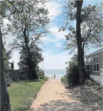  ?? PHOTOS BY JON WELLS ?? The view of a pathway to the beach at the Knight’s Beach Resort on Lake Erie, along Lakeshore Road, 15 minutes west of Dunnville.