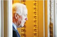  ?? AP PHOTO/ALEX BRANDON ?? Sen. John Cornyn, R-Texas, listens to a reporter’s question as he stands in the doorway to his office Tuesday on Capitol Hill.