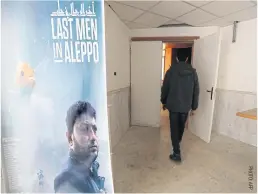  ??  ?? A poster ahead of the Oscar nominated film Last Men In Aleppo at the University of Idlib.