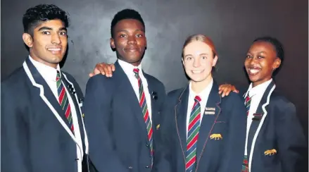  ?? ?? Changing of the guard: Outgoing headboy and headgirl Alister Reddy and Luthando Kunene (outside) congratula­te 2023 headboy Mvuso Ntshangase and headgirl Kelly Schnell (centre)