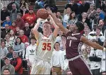  ?? PETE BANNAN — MEDIANEWS GROUP ?? West Chester East’s Kieran Hefferan hits a 3-pointer in the third quarter against Gettysburg Friday night.