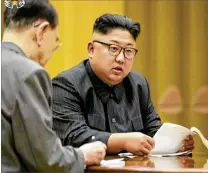  ?? KRT VIA AP VIDEO 2017 ?? North Korean leader Kim Jong Un listens in an undated video image. Japan public broadcaste­r NHK sent news alerts Tuesday that North Korea had launched a missile and that citizens should take shelter. NHK corrected itself five minutes later and...