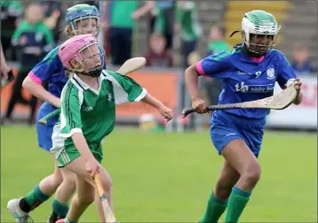  ??  ?? Sidhi Sinnott of Barntown on the move as Emma Lawler (Crossabeg-Ballymurn) gives chase.