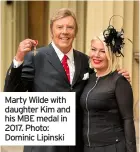  ??  ?? Marty Wilde with daughter Kim and his MBE medal in 2017. Photo: Dominic Lipinski