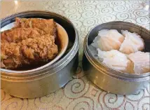  ?? PHOTOS CONTRIBUTE­D BY WENDELL BROCK ?? Crinkly skinned tofu wrappers stuffed with chicken and mushrooms and steamed dumplings with shrimp are among the dim sum classics you’ll find on the carts at East Pearl Seafood in Duluth every day of the week.