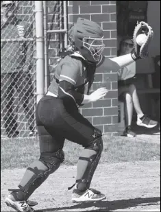  ?? Photo by John Zwez ?? Tianna Thompson holds up the ball after catching a foul popup for an out during Saturday’s game.