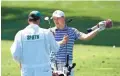  ?? ROB SCHUMACHER/THE REPUBLIC ?? Jordan Spieth talks to his caddie Michael Greller at the practice facility as he prepares for the Masters on Monday.