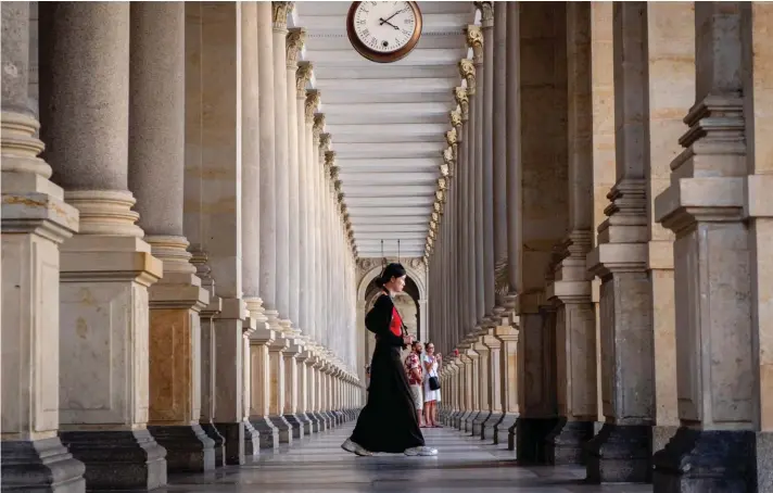  ?? ?? A tourist walks in one of the colonnades of Karlovy Vary (Carlsbad), Czech Republic, Friday, August 16, 2024. Photo: Associated Press/Michael Prost.