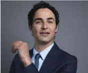  ?? AMY SUSSMAN/INVISION ?? Zac Posen got a boost early in his career from hip-hop mogul Sean (Puffy) Combs.