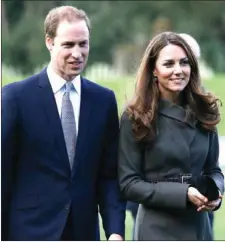  ?? THE ASSOCIATED PRESS ?? Prince William, left, and his wife Kate, the Duchess of Cambridge, visit a football training pitch at St George’s Park in Staffordsh­ire, England, in this Oct. 9 file photo.