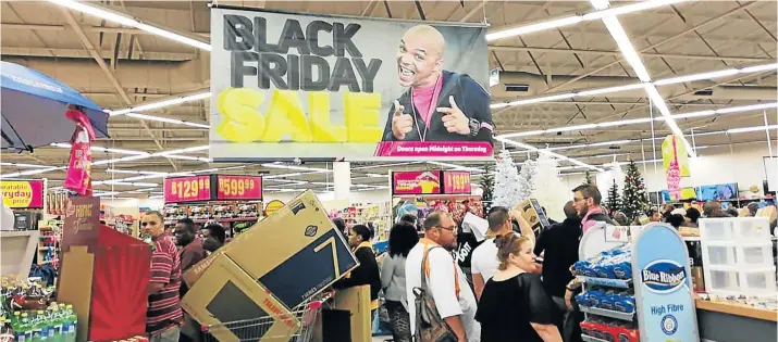  ?? Picture: MBALI TANANA ?? SPECIAL DAY: Customers flocked to Game stores which opened at midnight on Black Friday to lay their hands on specials up for offer.