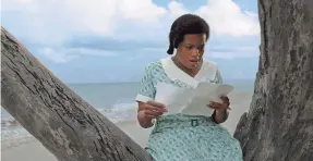  ?? PROVIDED BY WARNER BROS. PICTURES ?? Celie (Fantasia Barrino) reads a letter from her sister in movie musical “The Color Purple.” She first played the role on Broadway.
