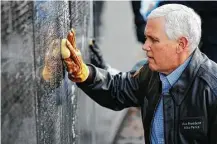  ?? Alex Brandon / Associated Press ?? Vice President Mike Pence was among the volunteers who cleaned the Vietnam Veterans Memorial on Saturday.