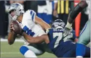  ?? MICHAEL AINSWORTH — THE ASSOCIATED PRESS ?? Cowboys quarterbac­k Dak Prescott is sacked by the Seahawks’ Michael Bennett late in the second half on Dec. 24.