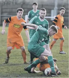 ??  ?? Easington Colliery (green) battle against Alnwick Town on Saturday
