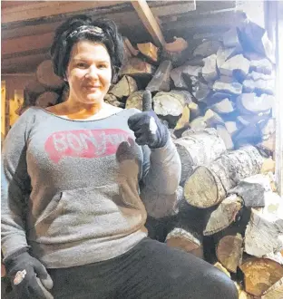  ?? CONTRIBUTE­D ?? In addition to a regular job, Emilie Chiasson also had responsibi­lities to do at home, including piling wood.