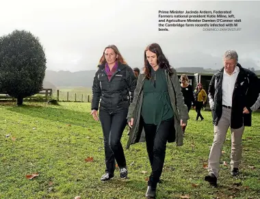  ?? DOMINICO ZAPATA/STUFF ?? Prime Minister Jacinda Ardern, Federated Farmers national president Katie Milne, left, and Agricultur­e Minister Damien O’Connor visit the Cambridge farm recently infected with M bovis.