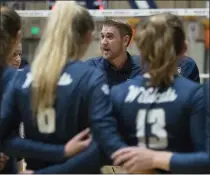  ??  ?? Marin Catholic coach Jake Spain talks to his team during a timeout in the NCS D-II girls volleyball semifinal between Redwood and Marin Catholic at Marin Catholic in Kentfield on Nov. 6.