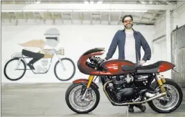  ?? Myung J. Chun Los Angeles Times ?? Austin Rothbard is the founder of a startup called Twisted Road, where motorcycle owners rent their rides such as this 2016 Triumph Thruxton R customized by Lossa Engineerin­g. This bike is available for $195 per day.