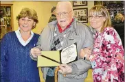  ?? NORWALK REFLECTOR ?? Charles Sharfenber­g received his diploma Monday at the Monroevill­e school board meeting.