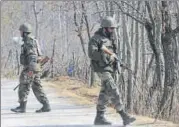  ?? WASEEM ANDRABI/HT ?? Soldiers stand guard during a gunbattle at Pakharpore village, south of Srinagar, on Thursday.
