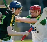  ??  ?? HEAD TO HEAD: James McNaughton from Antrim and Donegal’s Padhraic Doherty, right