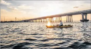  ??  ?? Hunting for tarpon at sunrise by the lift bridge in Terra Verde.