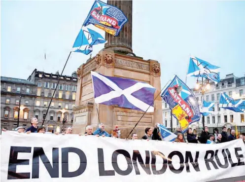  ?? PHOTO: ?? Independen­ce supporters gather in Glasgow’s George Square after Nicola Sturgeon’s call for a second referendum Jeff J Mitchell/Getty Images