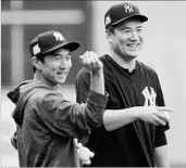  ?? ERIC GAY/AP ?? Interprete­r Shingo Horie, left, with Yankees Game 1 starter Masahiro Tanaka during a workout Thursday in Houston.
