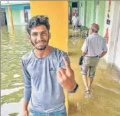  ?? PTI ?? A man casts his vote at an inundated polling station in Kerala’s Ernakulam after the state witnessed heavy rainfall on Monday.
