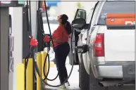  ?? Jerry Lara / San Antonio Express-News ?? A woman buys gasoline at a QuikTrip gas station in San Antonio, Texas, on Thursday.