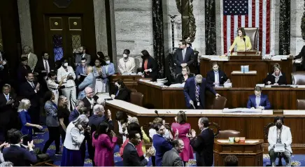  ?? PHOTO: REUTERS ?? Success . . . Democratic members of the US House of Representa­tives applaud and celebrate as Speaker of the House Nancy Pelosi lays down her gavel after the House passed the Inflation Reduction Act, which had already passed the US Senate, in Washington on Saturday.
