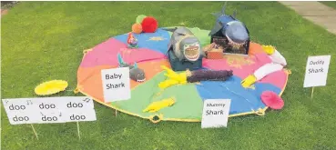  ??  ?? Shark attack The shark song scarecrows snap up third place