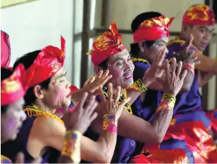  ?? Sonny Tumbelaka / AFP ?? Performers put on a traditiona­l dance show in Bengkala village, on Bali. A high percentage of the villagers have hearing issues so the village created its own sign language.