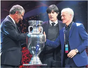  ??  ?? GROUP OF DEATH: Group F managers, Portugal’s Fernando Santos, Joachim Loew of Germany and head coach of France Didier Deschamps at the draw in Romania yesterday