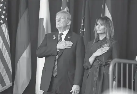  ?? EVAN VUCCI/AP ?? President Donald Trump and first lady Melania Trump join the Sept. 11 Flight 93 memorial service in Shanksvill­e, Pa. Ceremonies also were held at the World Trade Center in New York City and the Pentagon outside Washington.