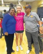  ?? CONTRIBUTE­D PHOTO ?? Covenant Keypers co-founders Rosalyn and Gary Hickman stand with Girls Preparator­y School student Brooke McCurdy, center, during the Game On basketball tournament.