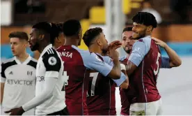  ??  ?? Tyrone Mings (right) celebrates after scoring Aston Villa’s third goal against Fulham at Craven Cottage. Photograph: Tom Jenkins/NMC Pool/The Guardian