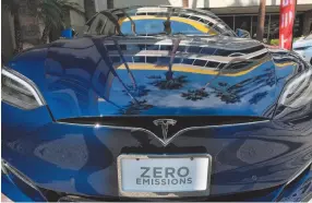  ?? CTIIZEN NEWS SERVICE FILE PHOTO ?? A Tesla Model S on display in downtown Los Angeles in 2016. Tesla says its got less accidents on its record than humans.